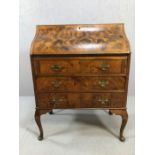 Antique writing desk or bureau with walnut book matched veneer finish on Queen Anne legs front and