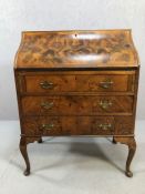 Antique writing desk or bureau with walnut book matched veneer finish on Queen Anne legs front and
