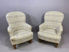 Pair of easy chairs in grey tartan on wooden turned feet