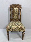 Gothic style heavily carved chair with bobbin turned legs and supports and floral carvings with