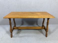 Oak coffee table with cross stretcher and bezel edges, approx 93cm x 46cm x 50cm