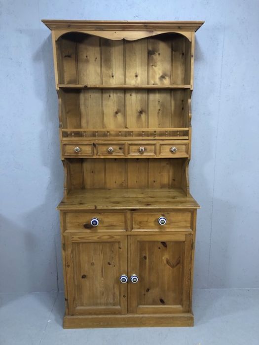 Pine kitchen dresser two drawers and two cupboards under four drawers and shelf above with