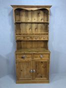 Pine kitchen dresser two drawers and two cupboards under four drawers and shelf above with