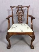 Single carved wooden armchair with newly upholstered seat