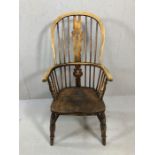 Antique Windsor stick back elbow chair, with wheelback detailing, on turned legs, height approx