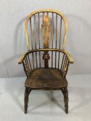 Antique Windsor stick back elbow chair, with wheelback detailing, on turned legs, height approx