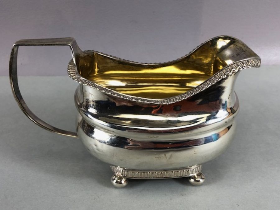 Silver Hallmarked Georgian milk jug on four bun feet with gold gilt interior hallmarked for Exeter - Image 3 of 10