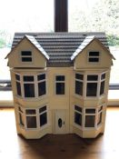 Large wooden hand-made dolls house with good collection of furniture, approx 55cm wide x 35cm deep x