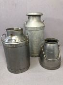 Three vintage galvanised metal milk churns, the largest by 'The Milk Marketing Board', 10 gallons