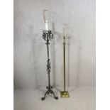 Two metal standard lamps one of corinthian column style