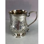 Hallmarked Silver Tankard with floral repousse design approx 9.5cm tall &147g hallmarked for