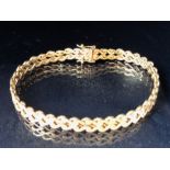 9ct Gold bracelet with curved interlocking links and good quality fastener with two safety catches