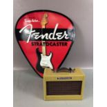 Fender Mini twin amp, approx 17cm x 13cm x 7cm, and a Fender Sratocaster metal sign