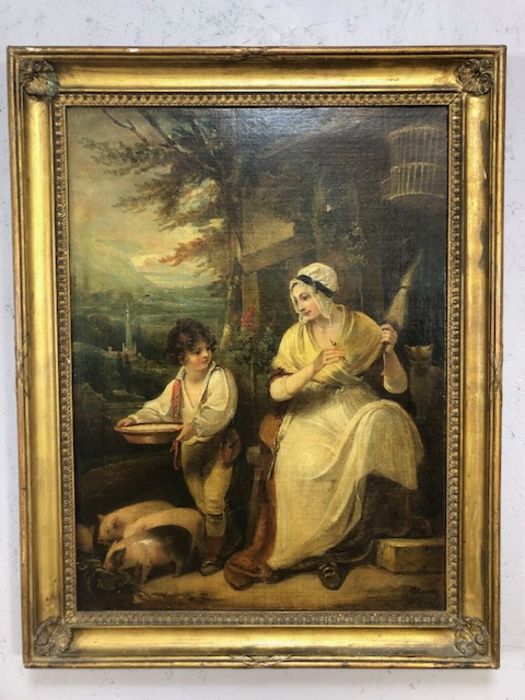 Oil on canvas of a woman and child, indistinctly signed lower right, approx 44cm x 60cm, in gilt