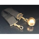 9ct gold Masonic ball on a ribbon with 9ct gold clasps and attachments total weight approx 14.8g (