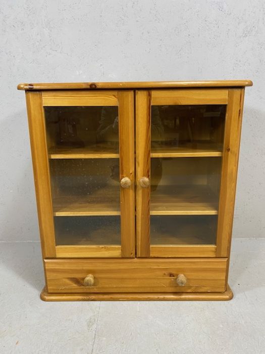 Pine unit with two glazed doors, two shelves and drawer under, approx 80cm x 39cm x 85cm