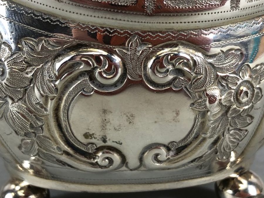 Silver hallmarked jug on four bun feet with gold gilt interior and repoussé floral decoration - Image 5 of 12