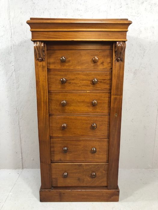 Six graduating drawer tall specimen cabinet in mahogany with bun handles, approx 60cm x 36cm x 124cm