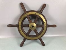 Wooden six spoke ships wheel with brass fittings and wooden handles, approx 42cm in diameter