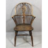 Antique Windsor stick back elbow chair, with wheelback detailing, on turned legs, height approx 99cm