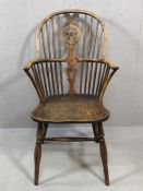 Antique Windsor stick back elbow chair, with wheelback detailing, on turned legs, height approx 99cm