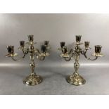 Pair of hallmarked silver four branch candlesticks on circular bases hallmarked for London 1967
