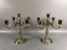 Pair of hallmarked silver four branch candlesticks on circular bases hallmarked for London 1967