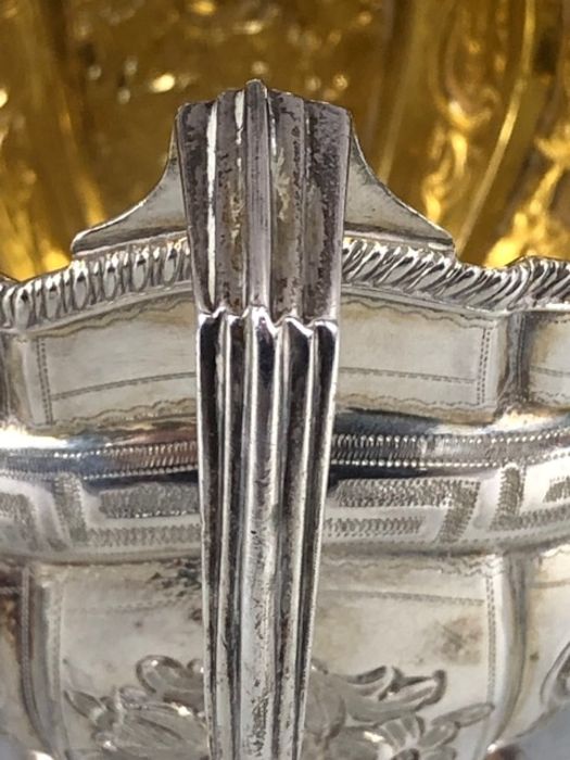 Silver hallmarked jug on four bun feet with gold gilt interior and repoussé floral decoration - Image 11 of 12