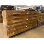 Mid century plan chest with wooden handles in two sections consisting of six drawers