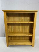 Modern oak bookcase with two shelves, approx 89cm x 30cm x 109cm tall