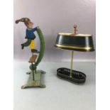 Vintage metalware to include a rocking clown and candle holder with shade (2)