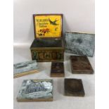 Collection of vintage printing blocks in tin