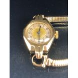 9ct Gold watch, movement by BENSON with a 9ct Gold strap, Gold case in an Art Deco style total