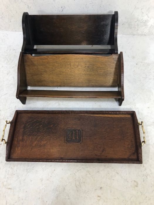 Two wooden book stands and an oak tea tray with brass handles and carved detailing letter 'M'