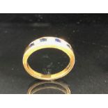 18ct Gold fully hallmarked Diamond and Sapphire ring set with three diamonds and four Sapphires