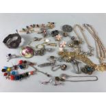 A collection of costume Jewellery, to include broaches, bangle, necklaces earrings all AF