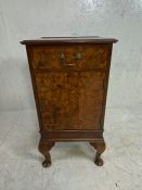 A single walnut veneered bedside cabinet with drawer and cupboard on queen ann legs