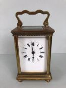 Carriage clock with white enamel face with roman numerals and two keys