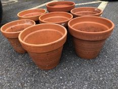 Seven Terracotta garden plant pots