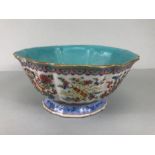 Chinese bowl with blue green glaze and famile rose pattern on raised foot painted with flora and