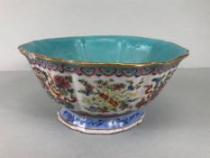 Chinese bowl with blue green glaze and famile rose pattern on raised foot painted with flora and