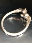 HERMES: Twin horse head silver coloured bangle marked Hermes Made in France