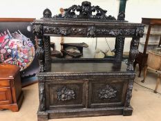 Antique buffet or dresser with carved lion supports, heavy carved foliate design and incorporating