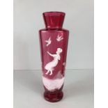 Glassware: a Mary Gregory style cranberry vase approx 29cm in height