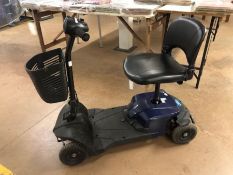 CareCo Mobility Scooter in blue/back, with charger