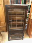 Leaded glass front wooden display cabinet with two internal shelves, approx 61cm x 25cm x 130cm