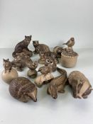 Poole pottery, a collection of Poole pottery animals 14 in total, to include, Badgers, Crocodile,