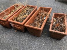 Four Terracotta garden troughs