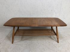 Ercol Coffee Table, Ercol Mid century light elm Coffee table on splay legs with magazine shelf,