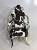 Large contemporary armchair in faux cowhide and horn, approx 128cm height at back